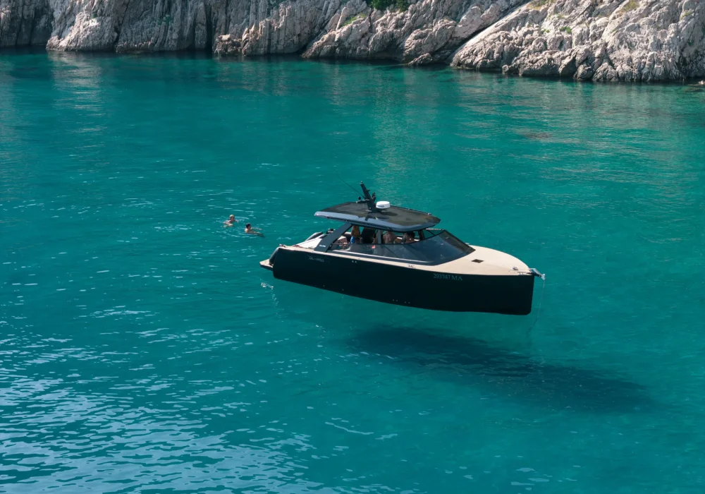 Aerial drone view of Colnago 38 OPEN anchored in turquoise Adriatic water