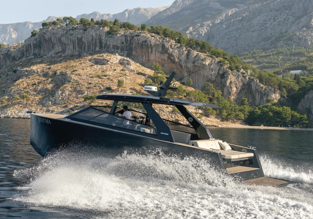 Colnago 38 OPEN luxury boat cruising near Makarska Riviera cliffs