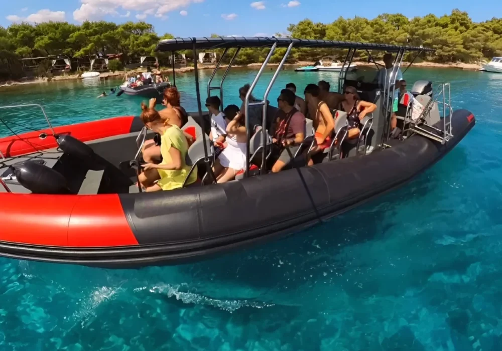 Friends enjoying a shared speedboat experience on Narwhal Orca 1000 in crystal-blue water