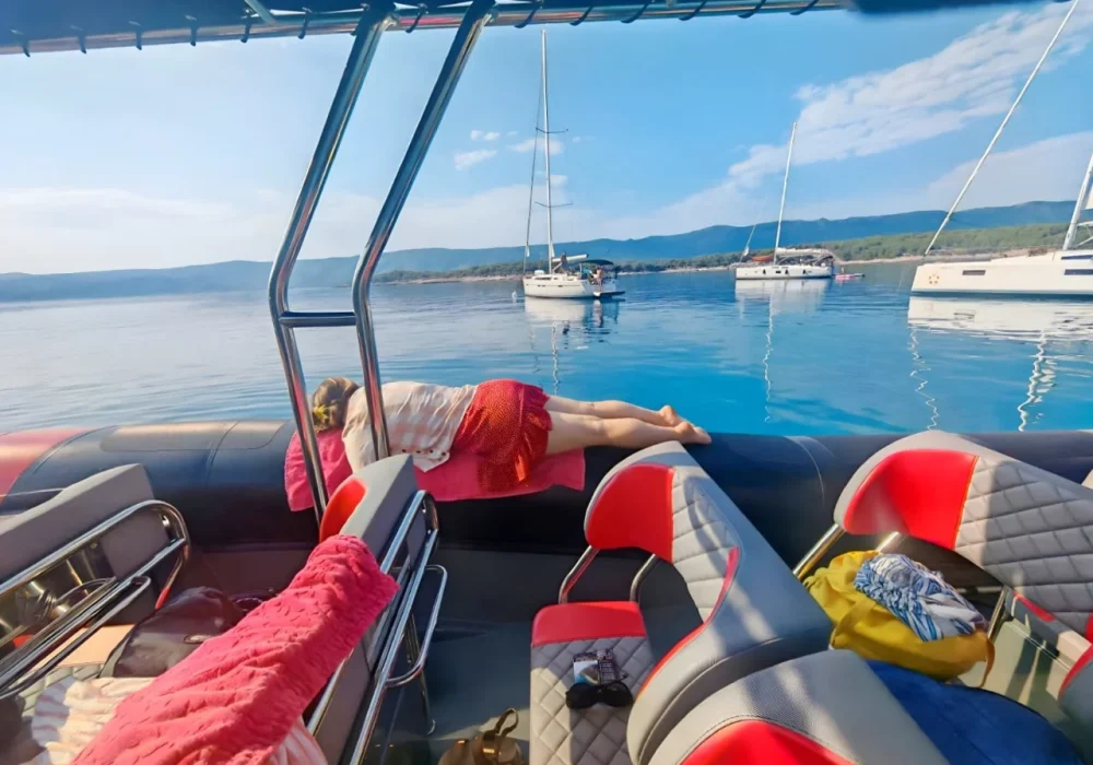 Guests relaxing on a Narwhal Orca 1000 speedboat during a calm cruise